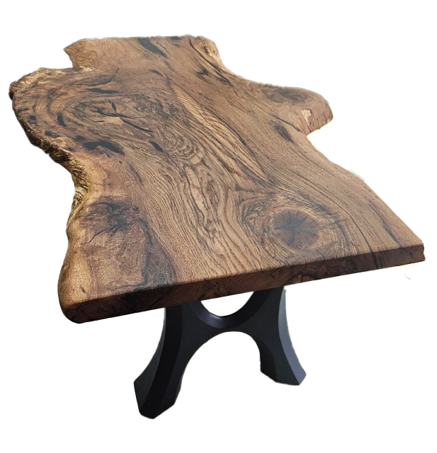 A stained slab of wood coffee table with black legs.