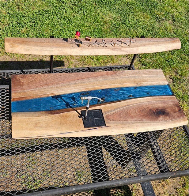 Photo of a epoxy decorated fly tying station.